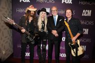 Billy Ray Cyrus (L) and Firerose (C) (Image via Getty)